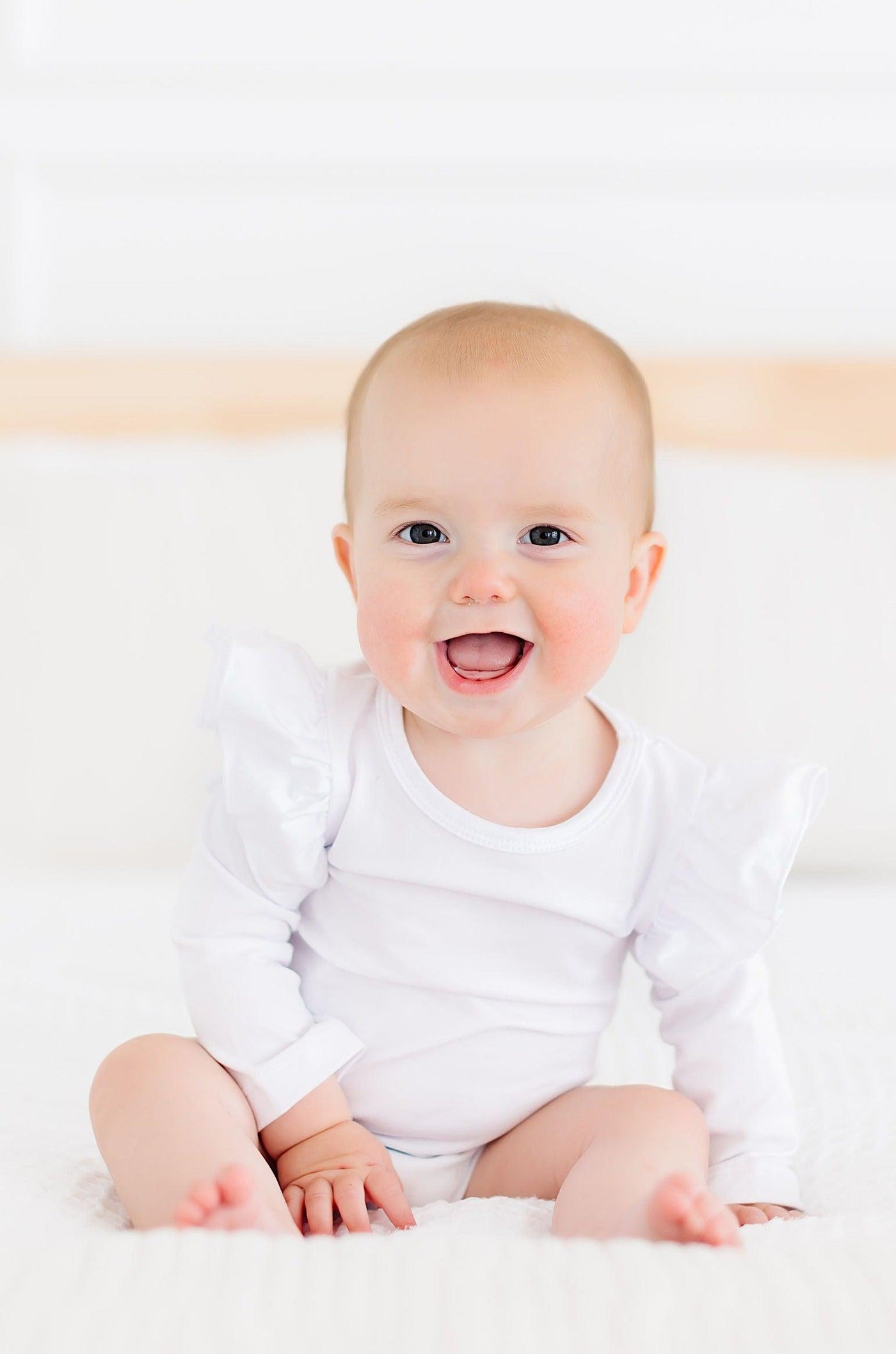 Mila & Rose:  White L/S Flutter Bodysuit